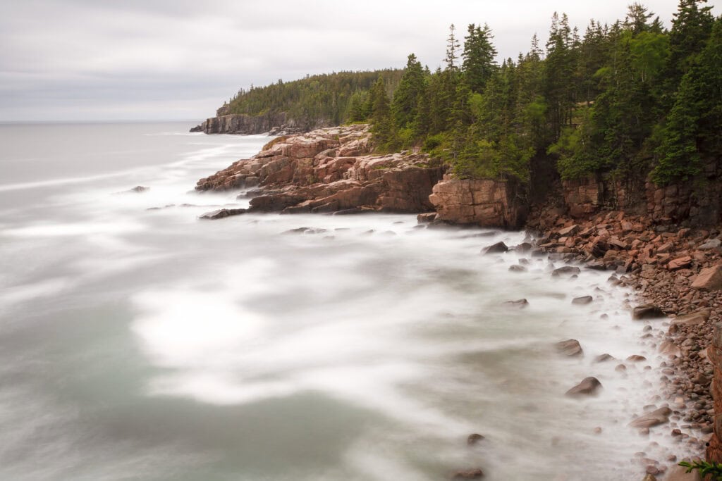 The Long Conversation color long exposure photograph of surf washing over pink granite ledges along the Maine coast, Acadia National Park, Maine, fine art landscape photography by Brad Emerson